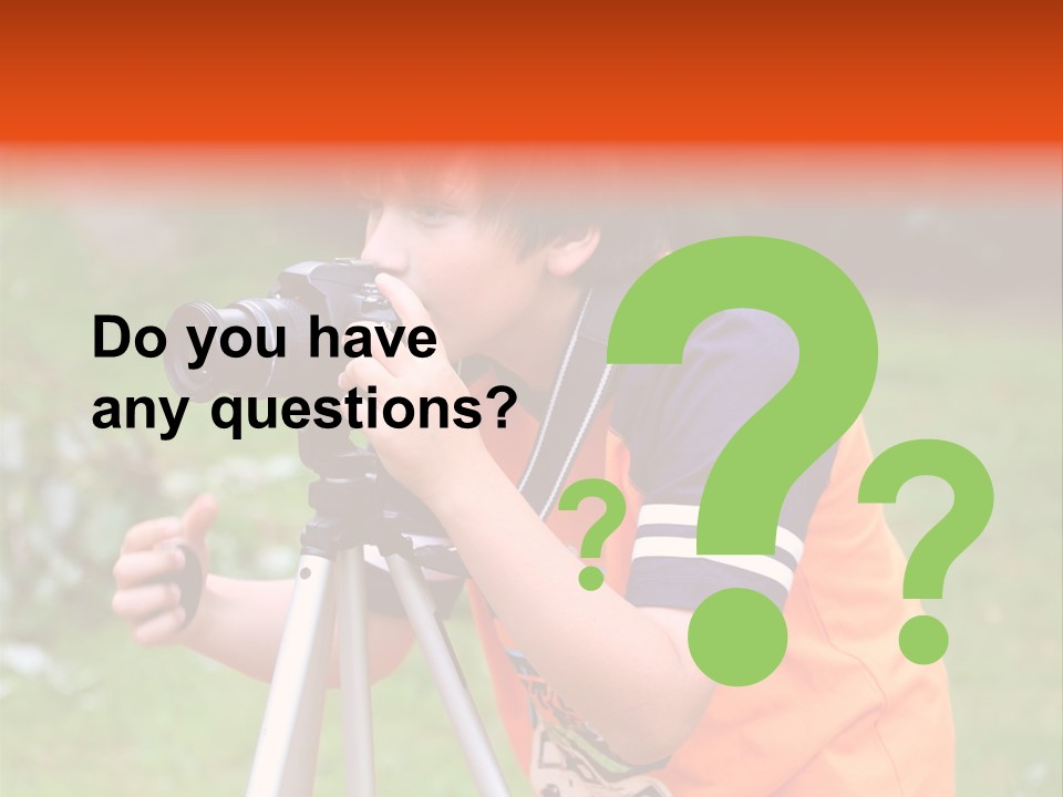 A Young Boy Taking A Picture With A Camera PowerPoint Template