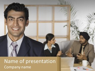 A Man In A Suit Standing In Front Of A Group Of People PowerPoint Template