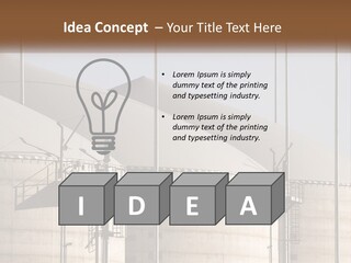A Power Plant With A Sign In Front Of It PowerPoint Template
