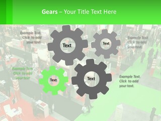 A Large Group Of People Standing Around A Booth PowerPoint Template