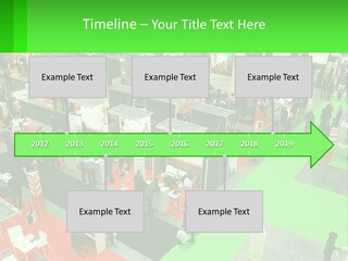 A Large Group Of People Standing Around A Booth PowerPoint Template