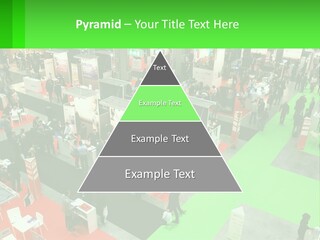 A Large Group Of People Standing Around A Booth PowerPoint Template