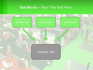 A Large Group Of People Standing Around A Booth PowerPoint Template