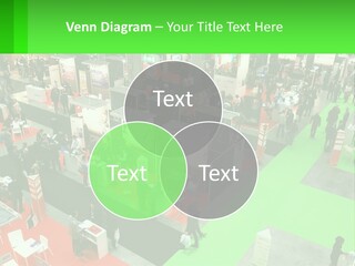 A Large Group Of People Standing Around A Booth PowerPoint Template