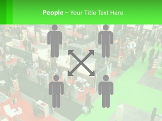 A Large Group Of People Standing Around A Booth PowerPoint Template
