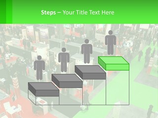 A Large Group Of People Standing Around A Booth PowerPoint Template