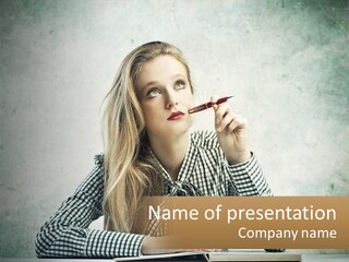 A Woman Sitting At A Table With A Pen In Her Mouth PowerPoint Template