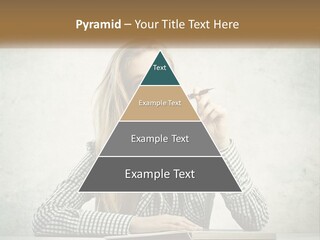 A Woman Sitting At A Table With A Pen In Her Mouth PowerPoint Template