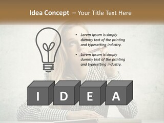 A Woman Sitting At A Table With A Pen In Her Mouth PowerPoint Template