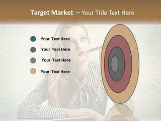A Woman Sitting At A Table With A Pen In Her Mouth PowerPoint Template