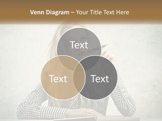 A Woman Sitting At A Table With A Pen In Her Mouth PowerPoint Template