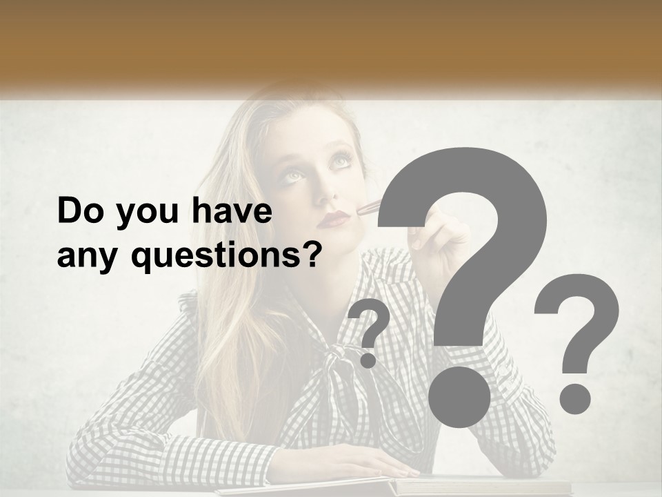 A Woman Sitting At A Table With A Pen In Her Mouth PowerPoint Template