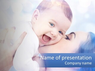 A Woman Holding A Baby In Her Arms PowerPoint Template