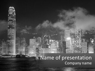 A Black And White Photo Of A City At Night PowerPoint Template