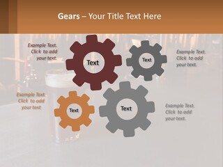 A Glass Of Beer Sitting On A Bar PowerPoint Template