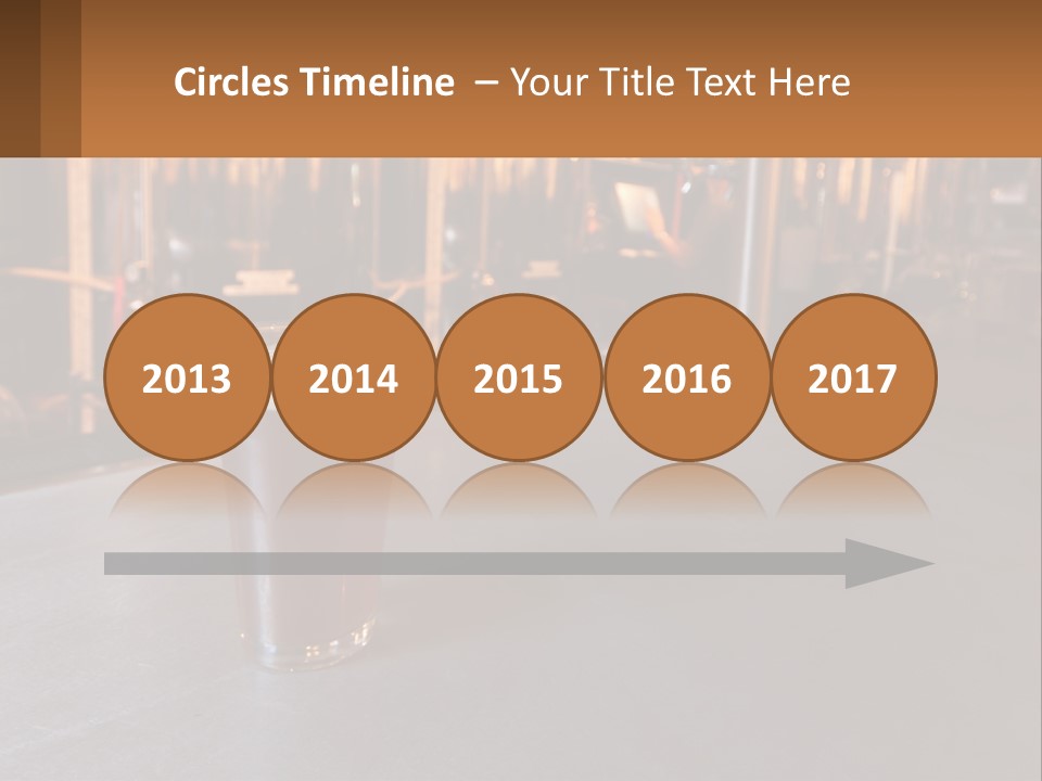 A Glass Of Beer Sitting On A Bar PowerPoint Template