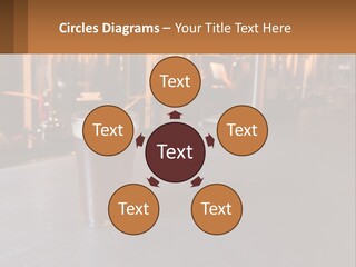 A Glass Of Beer Sitting On A Bar PowerPoint Template
