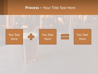 A Glass Of Beer Sitting On A Bar PowerPoint Template