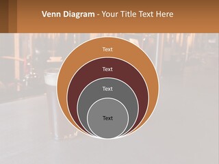 A Glass Of Beer Sitting On A Bar PowerPoint Template
