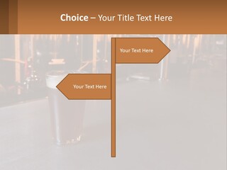 A Glass Of Beer Sitting On A Bar PowerPoint Template