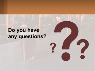 A Glass Of Beer Sitting On A Bar PowerPoint Template