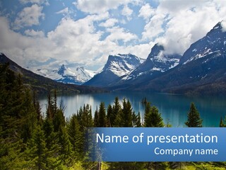 A Scenic View Of A Lake Surrounded By Mountains PowerPoint Template