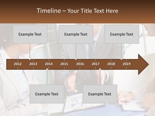 A Group Of People Sitting Around A Table Talking PowerPoint Template