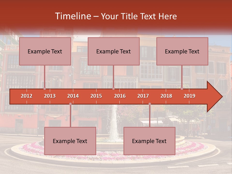 A Fountain In Front Of A Row Of Multi - Colored Buildings PowerPoint Template