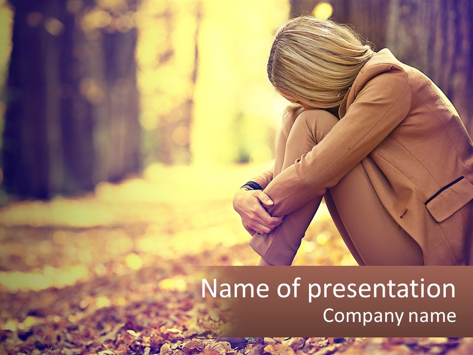 A Woman Sitting On The Ground In The Woods PowerPoint Template