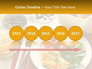 A Plate Of Food On A Table With A Glass Of Orange Juice PowerPoint Template