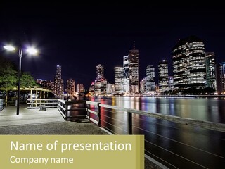 A City Skyline At Night With Lights On PowerPoint Template