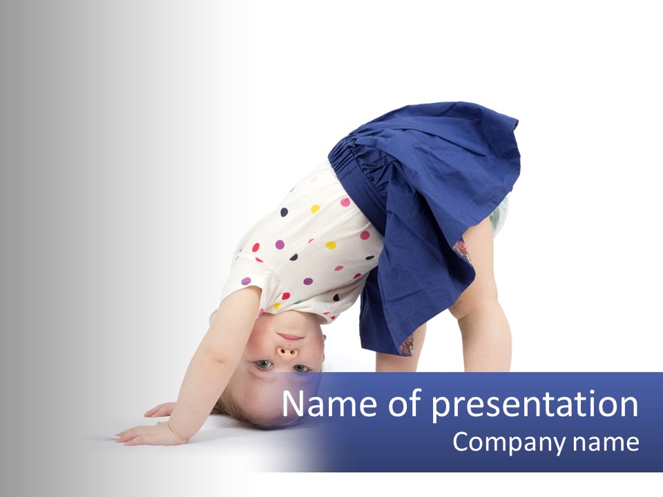 A Young Child Is Doing A Handstand On The Ground PowerPoint Template