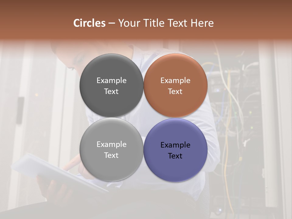 A Man Sitting In Front Of A Server In A Server Room PowerPoint Template