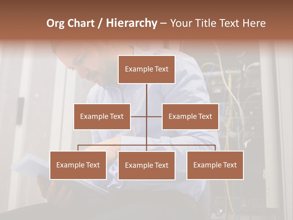 A Man Sitting In Front Of A Server In A Server Room PowerPoint Template