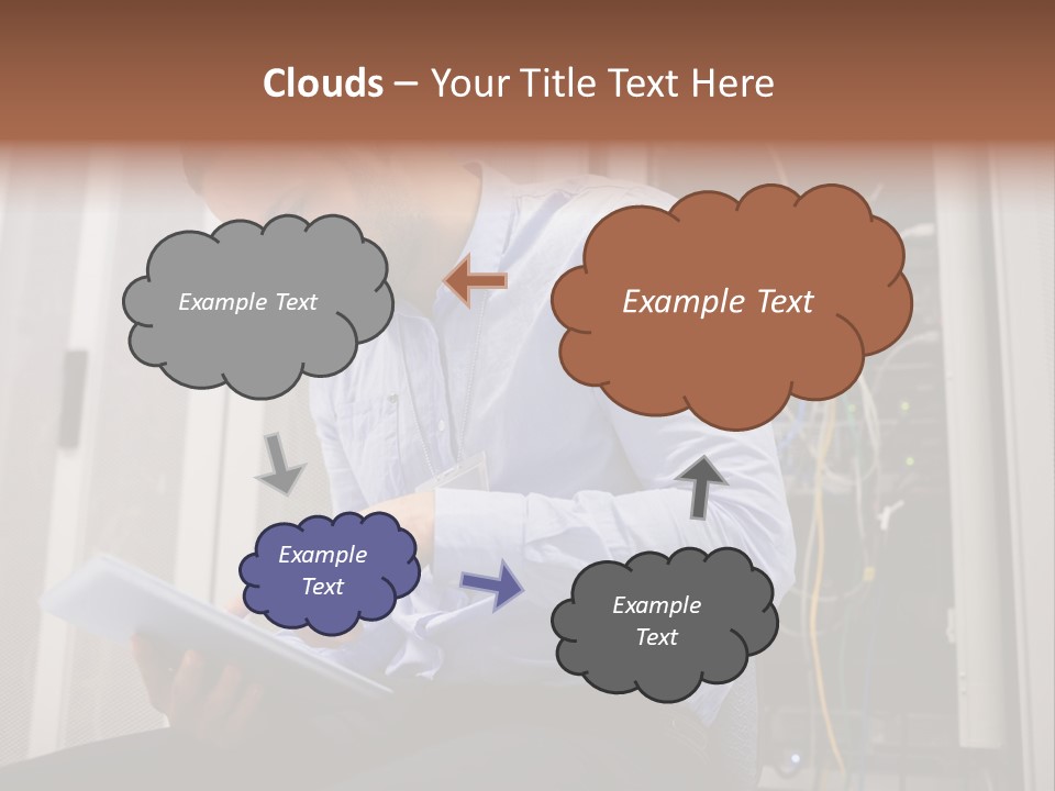 A Man Sitting In Front Of A Server In A Server Room PowerPoint Template