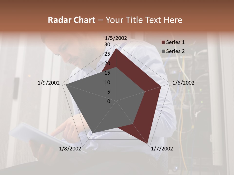 A Man Sitting In Front Of A Server In A Server Room PowerPoint Template