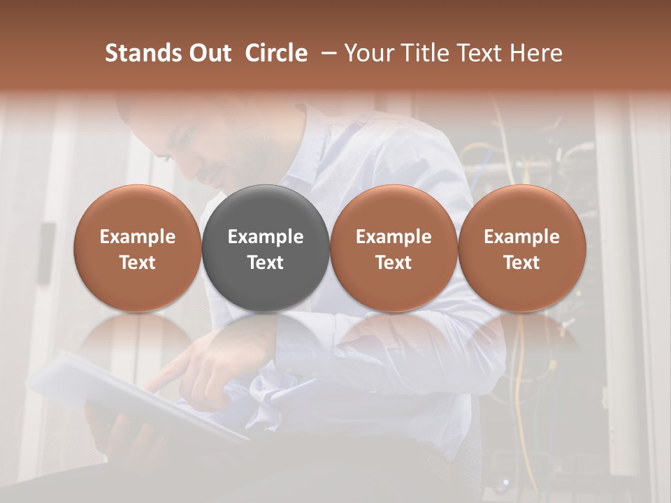 A Man Sitting In Front Of A Server In A Server Room PowerPoint Template