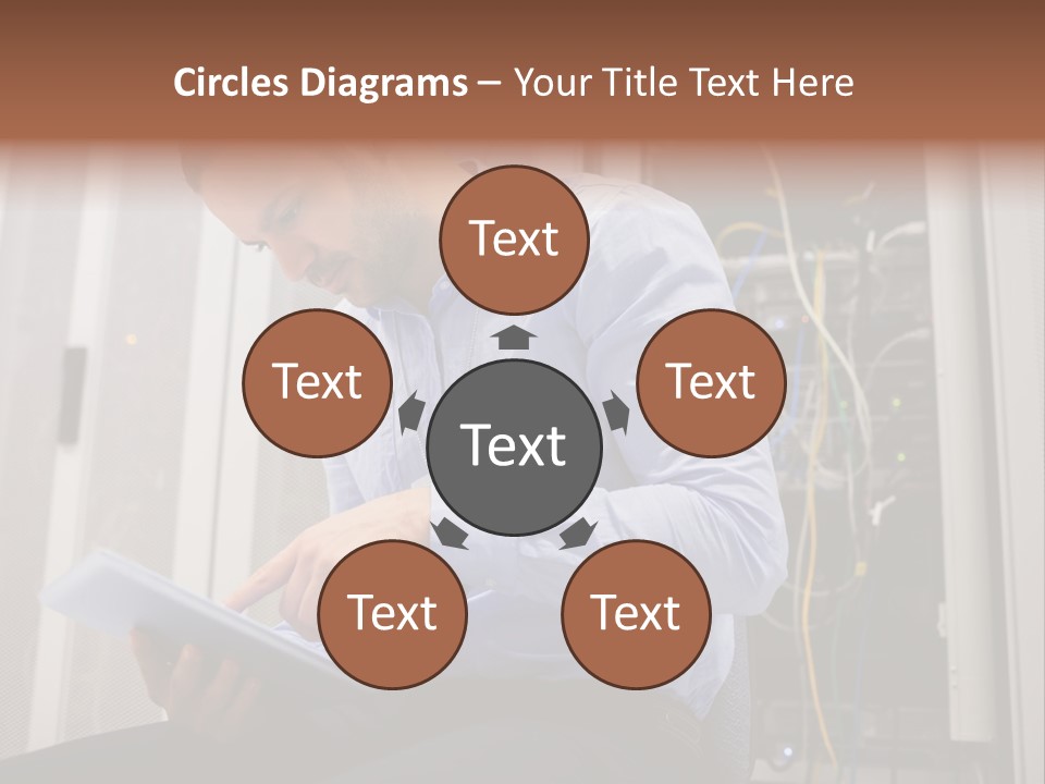 A Man Sitting In Front Of A Server In A Server Room PowerPoint Template
