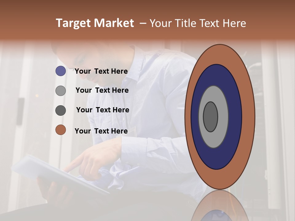 A Man Sitting In Front Of A Server In A Server Room PowerPoint Template