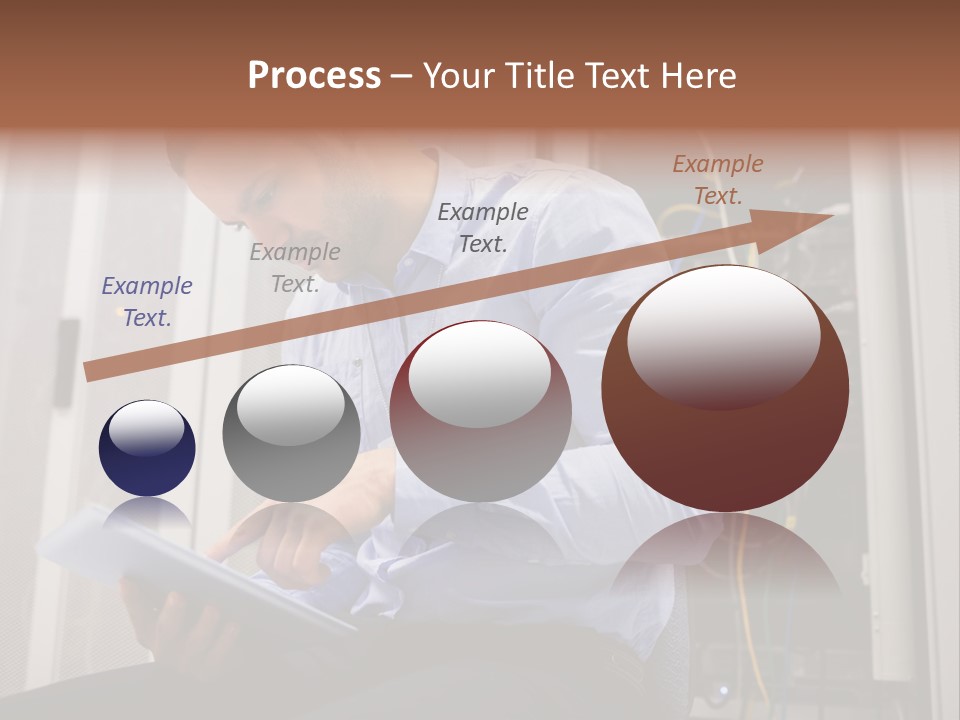 A Man Sitting In Front Of A Server In A Server Room PowerPoint Template