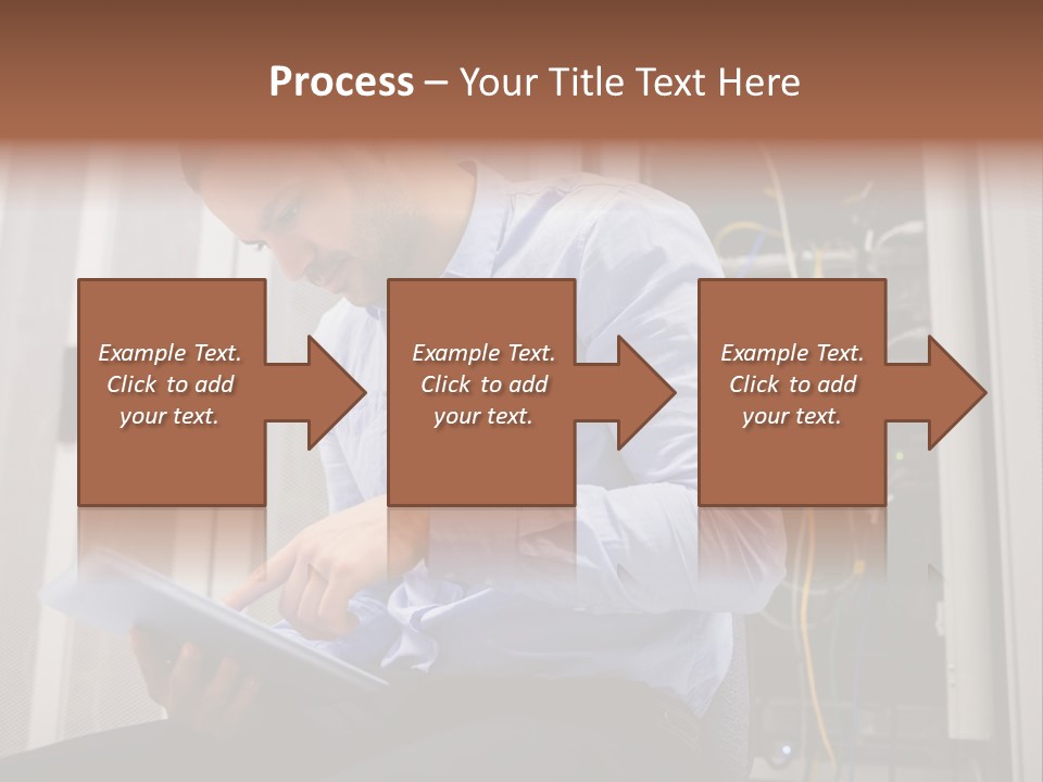A Man Sitting In Front Of A Server In A Server Room PowerPoint Template