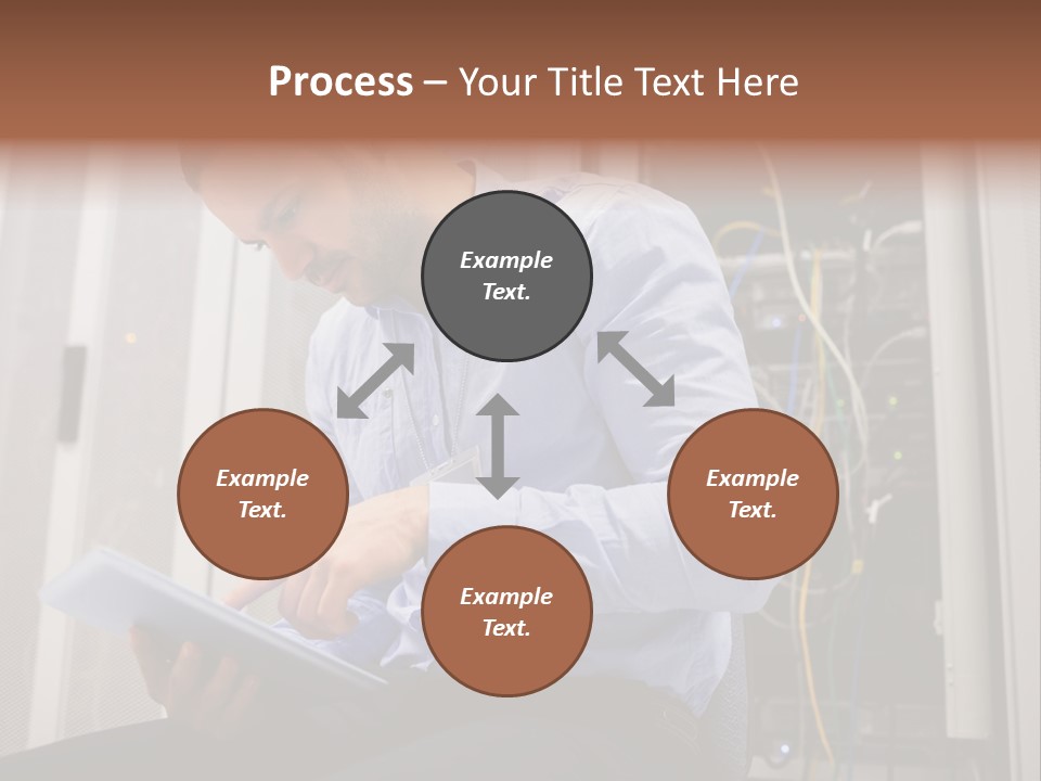 A Man Sitting In Front Of A Server In A Server Room PowerPoint Template