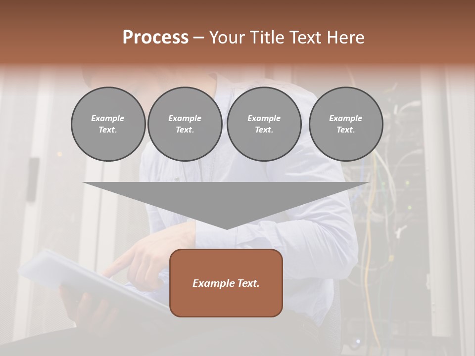 A Man Sitting In Front Of A Server In A Server Room PowerPoint Template