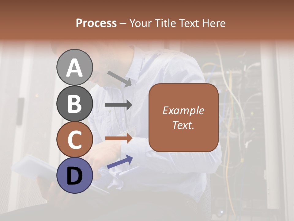 A Man Sitting In Front Of A Server In A Server Room PowerPoint Template