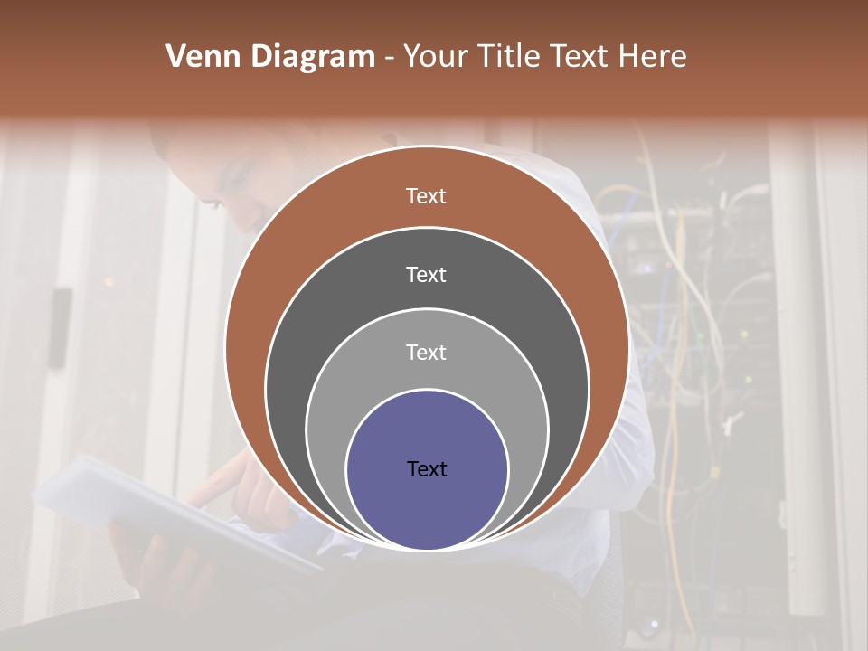 A Man Sitting In Front Of A Server In A Server Room PowerPoint Template