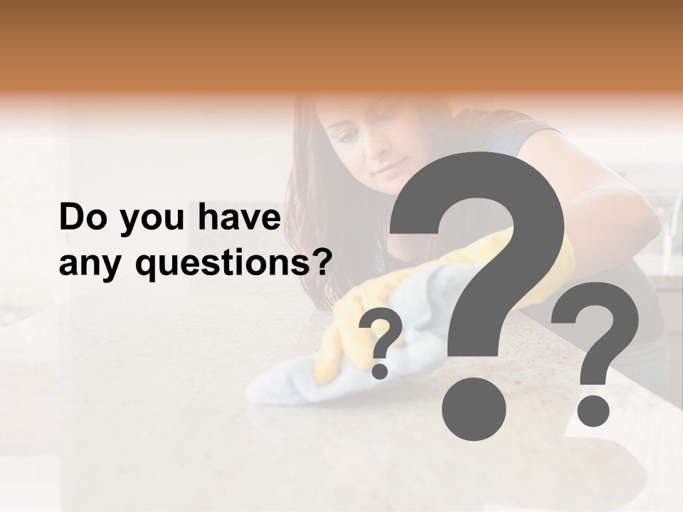 A Woman Cleaning A Kitchen Counter With Yellow Gloves PowerPoint Template