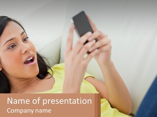 A Woman Sitting On A Couch Holding A Cell Phone PowerPoint Template