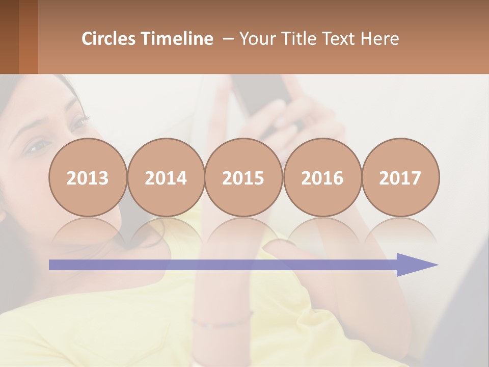 A Woman Sitting On A Couch Holding A Cell Phone PowerPoint Template