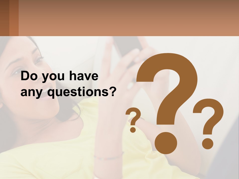 A Woman Sitting On A Couch Holding A Cell Phone PowerPoint Template