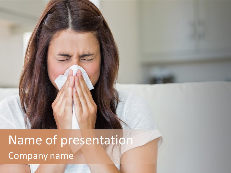 A Woman Blowing Her Nose While Sitting On A Couch PowerPoint Template